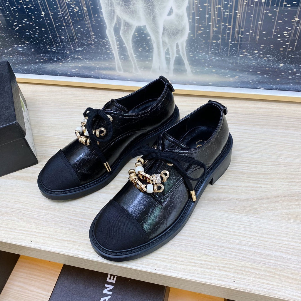 CHANEL COMBAT OXFORD SHOES IN BLACK WRINKLED CALFSKIN AND GROSGRAIN WITH FAUX PEARL