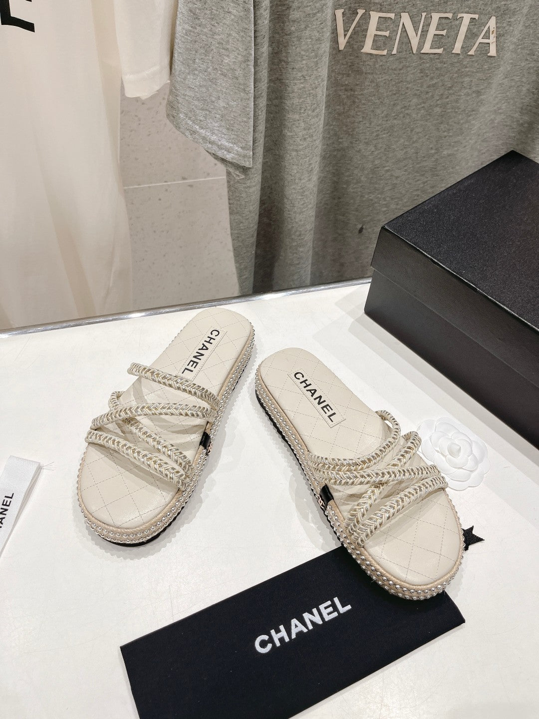 CHANEL WOVEN STRAP SLIPPERS IN WHITE LAMBSKIN